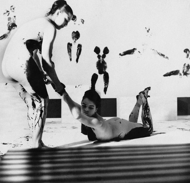Archival photograph of paint and body prints in an artist's studio
